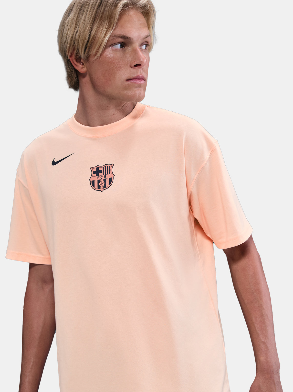 Light peach FC Barcelona Nike t-shirt with short sleeves and club crest on the chest