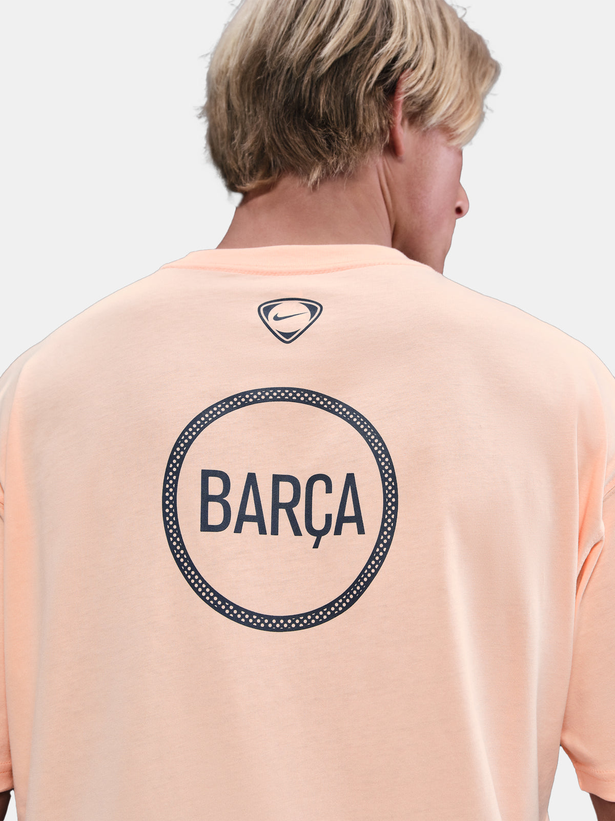 Light peach FC Barcelona Nike t-shirt with short sleeves and club crest on the chest