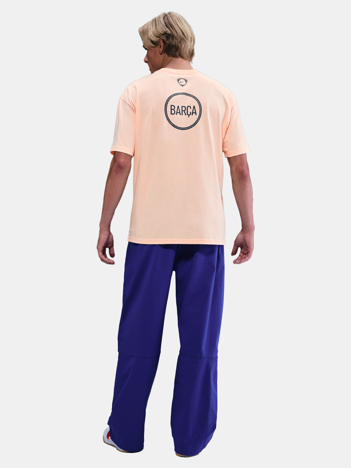 Light peach FC Barcelona Nike t-shirt with short sleeves and club crest on the chest