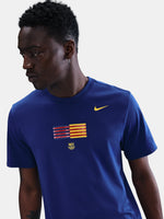 FC Barcelona men's t-shirt in royal blue featuring a minimalist front graphic with the Catalan and club colors, accompanied by the Nike Swoosh and Barça’s “Més que un club” symbol underneath. The design offers a clean and athletic streetwear look, perfect for everyday wear or matchday style.
