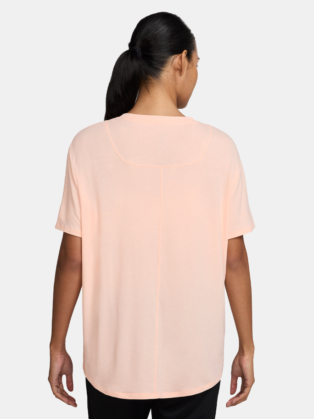 Light peach FC Barcelona Nike women's t-shirt with short sleeves and club crest on the chest.