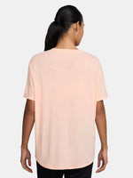 Light peach FC Barcelona Nike women's t-shirt with short sleeves and club crest on the chest.