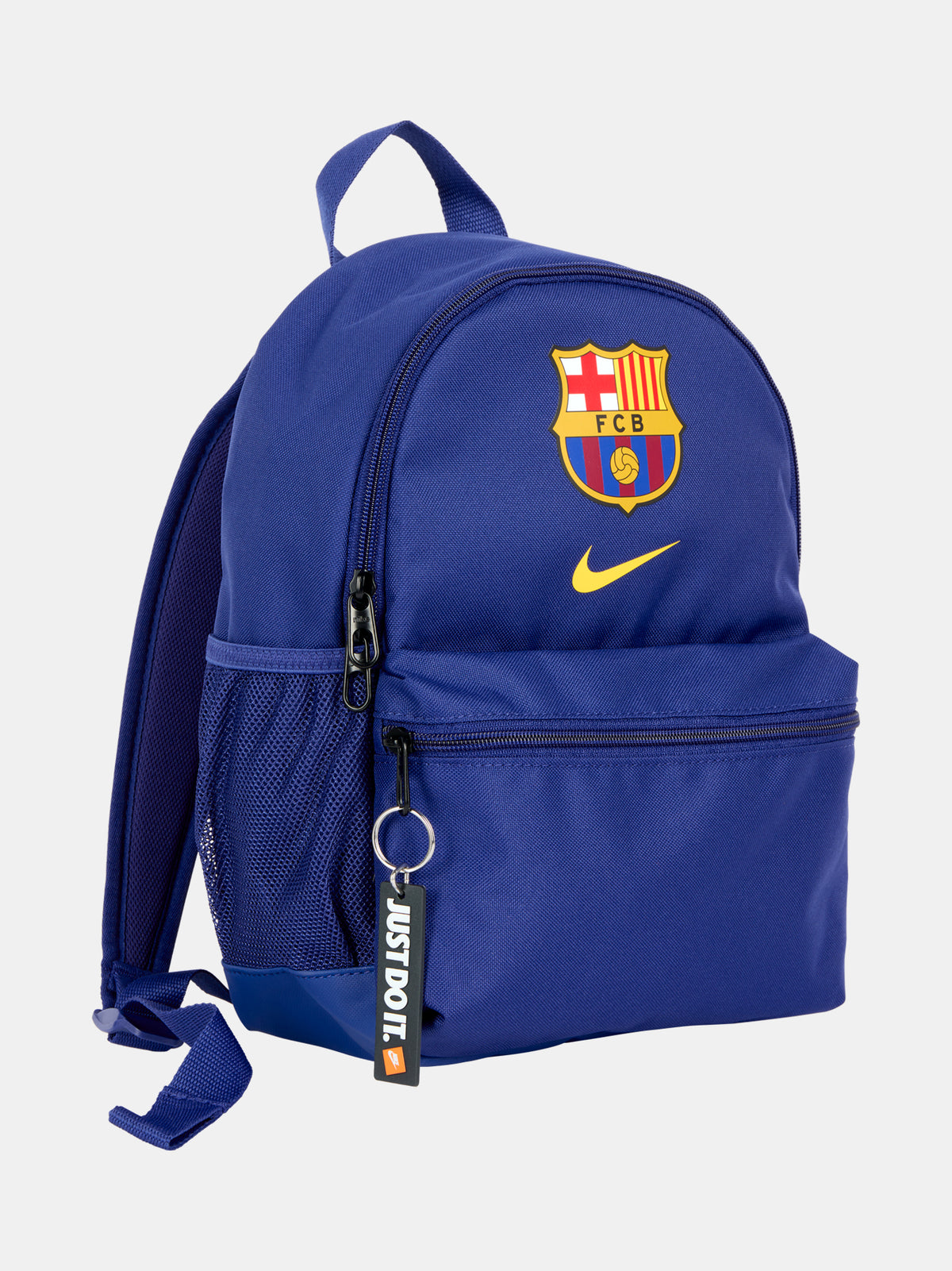 Mini FC Barcelona backpack in bold royal blue, featuring the Barça crest and yellow Nike swoosh on the front. Includes a front zip pocket, side mesh compartments, and a top handle. Finished with a black “JUST DO IT.” tag for a sporty touch.
