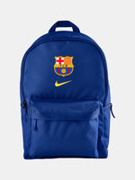 FC Barcelona 2025/26 backpack in deep royal blue, featuring the iconic club crest and a yellow Nike swoosh on the front. Includes a large main compartment, a front zip pocket for essentials, and padded shoulder straps for comfort.
