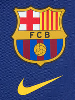 FC Barcelona 2025/26 backpack in deep royal blue, featuring the iconic club crest and a yellow Nike swoosh on the front. Includes a large main compartment, a front zip pocket for essentials, and padded shoulder straps for comfort.
