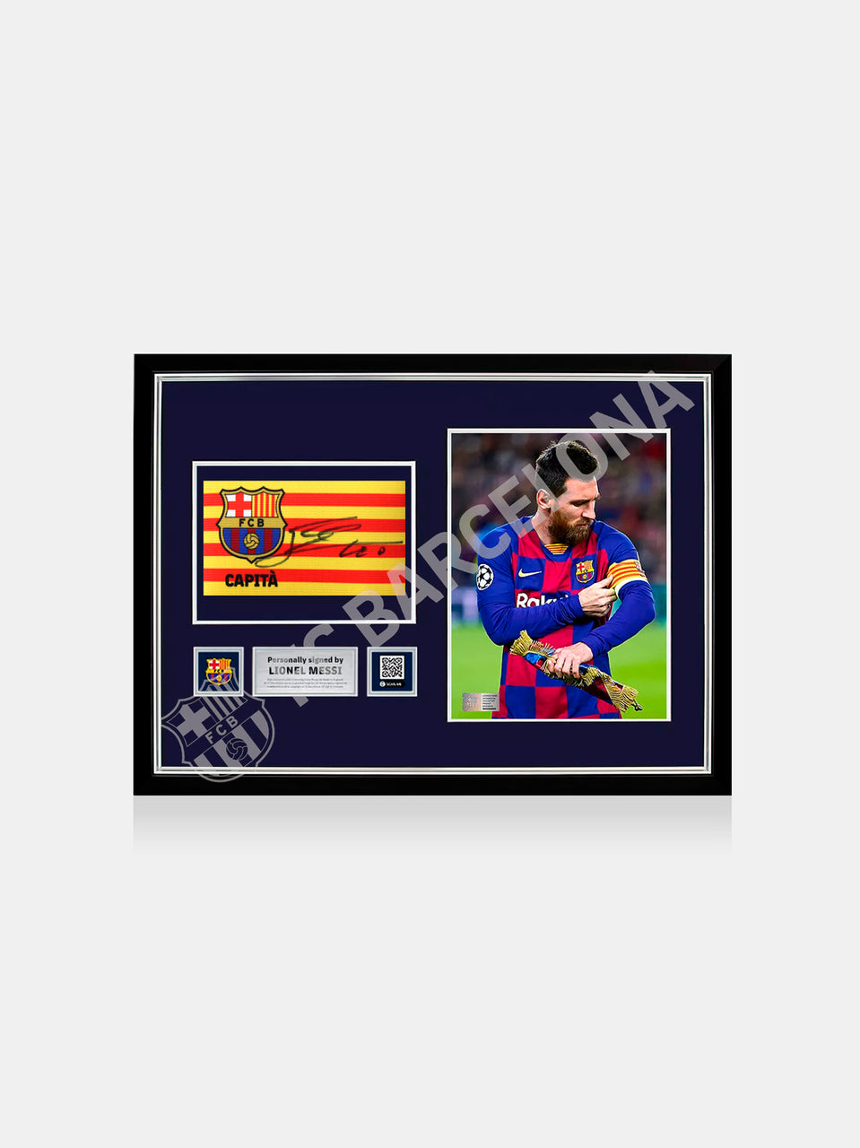 Framed FC Barcelona memorabilia featuring a signed captain's armband and a photo of Leo Messi wearing the armband during a match. Includes official certification plaque