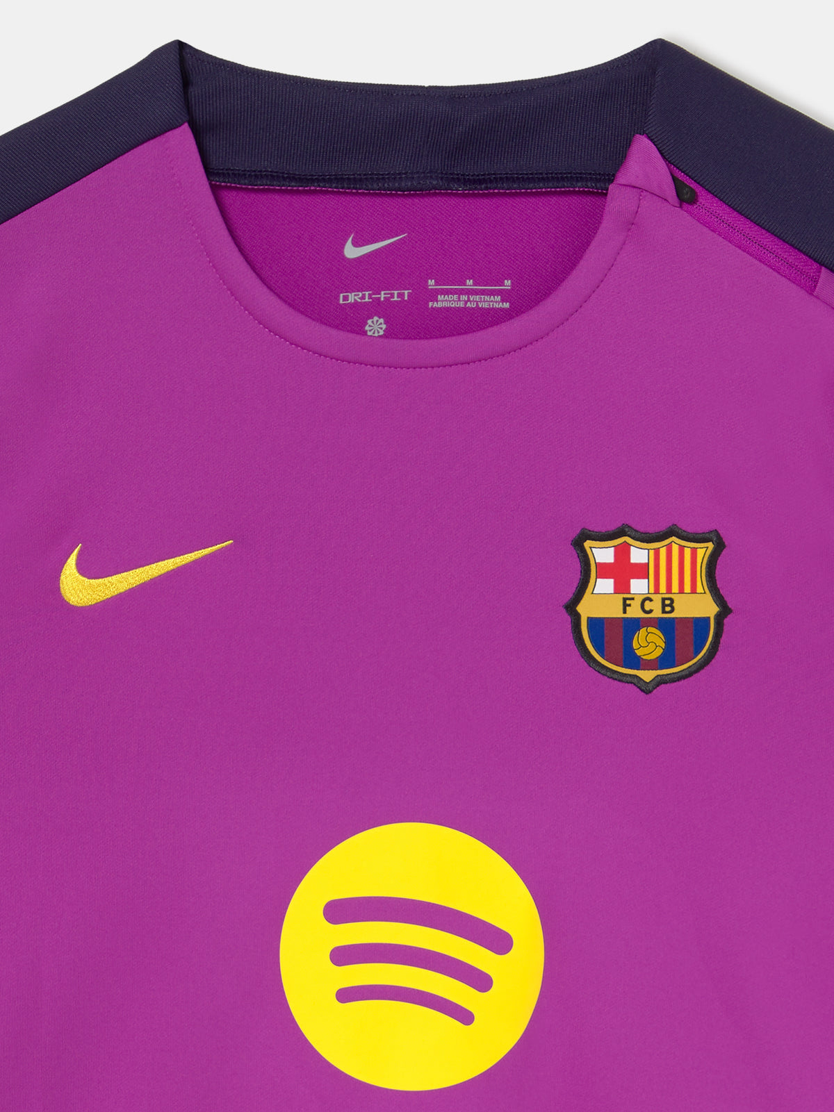 Front view of FC Barcelona 25/26 long-sleeve training top in purple with dark sleeves, featuring Spotify logo, Nike swoosh, and club crest