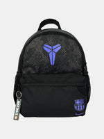 Small black FC Barcelona Nike backpack with textured upper panel, featuring the Kobe Bryant logo in blue on the front, the Barça crest with Nike swoosh in blue on the lower pocket, and a side tag reading 'Just Do It