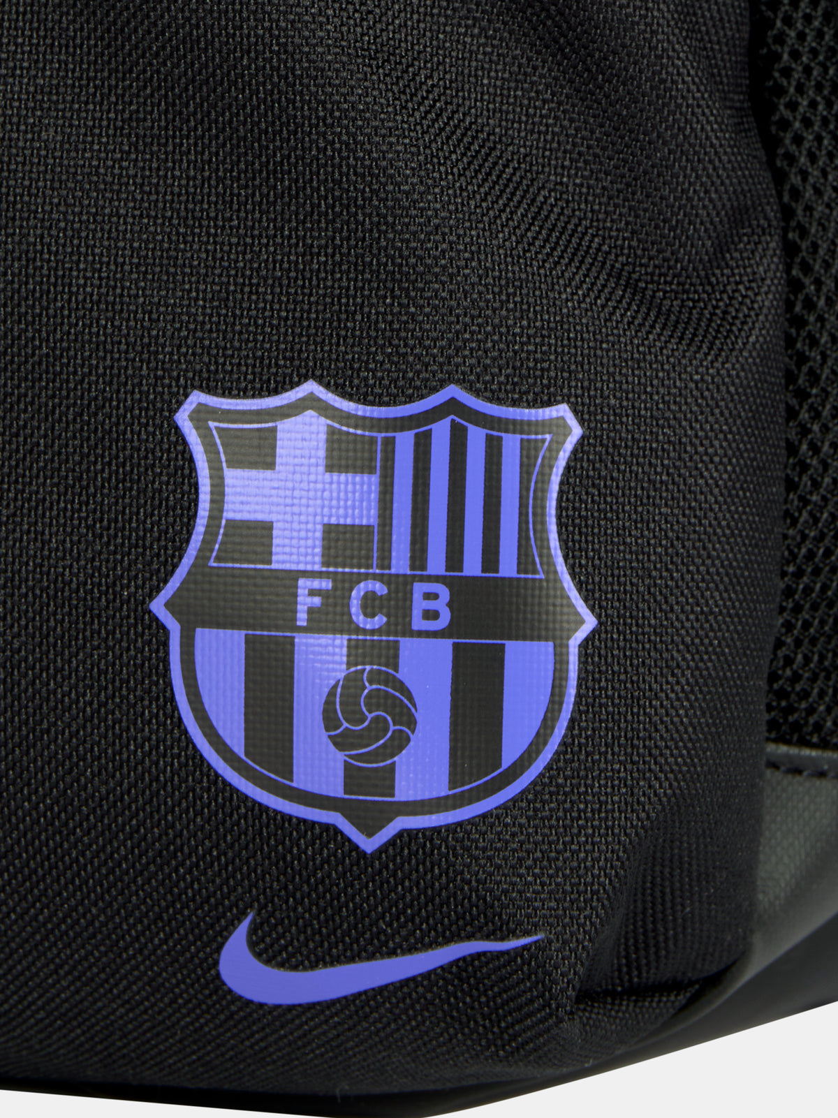 Small black FC Barcelona Nike backpack with textured upper panel, featuring the Kobe Bryant logo in blue on the front, the Barça crest with Nike swoosh in blue on the lower pocket, and a side tag reading 'Just Do It