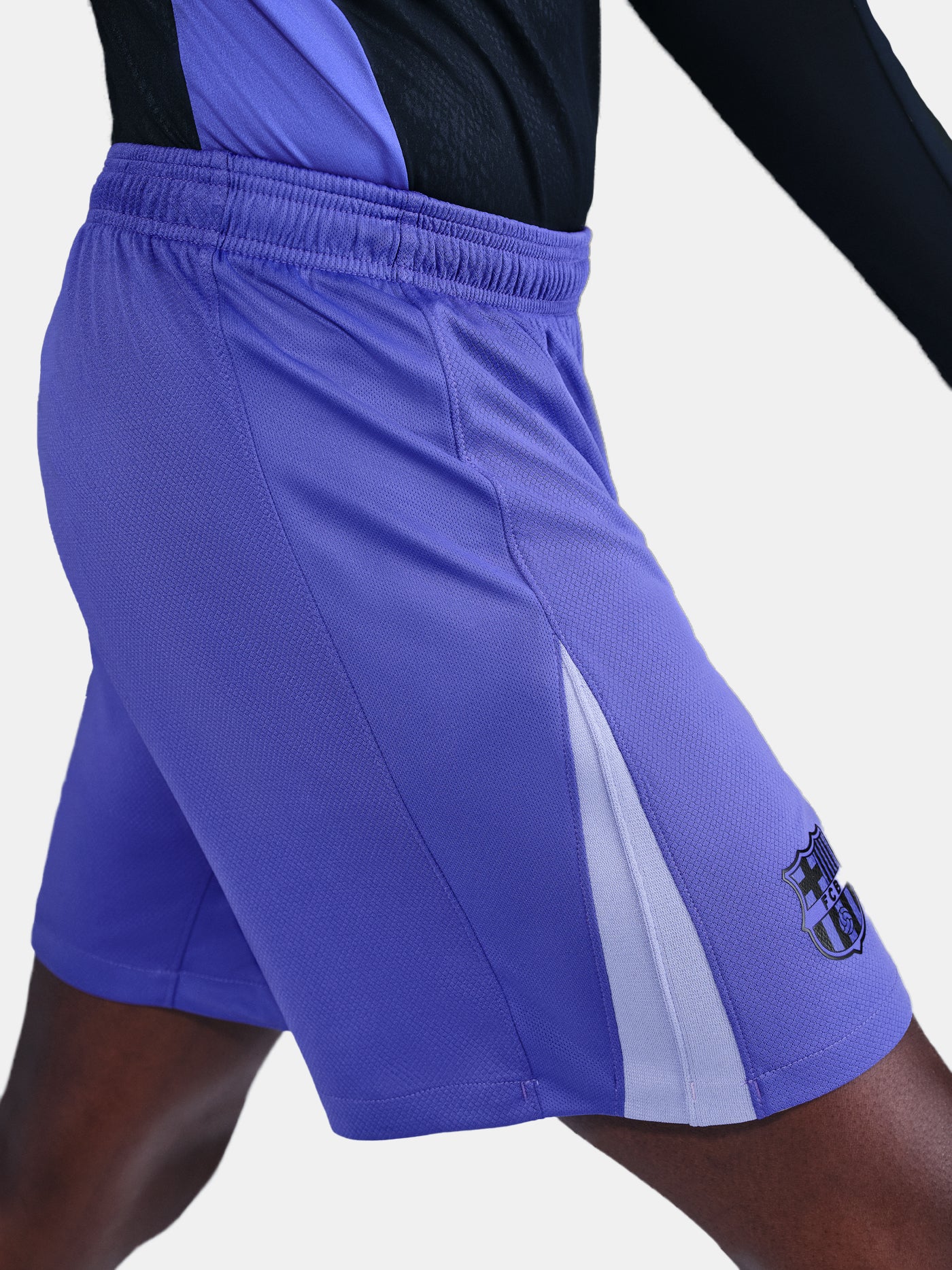Blue athletic shorts with a logo on a white background