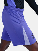 Blue athletic shorts with a logo on a white background