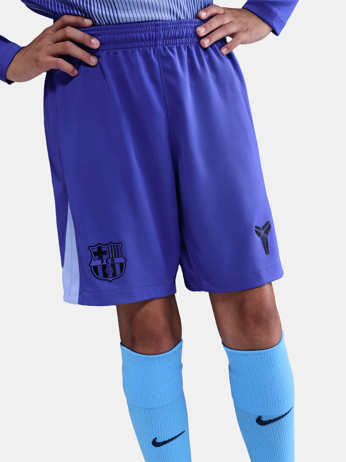 Blue shorts with a logo worn by a person on a white background