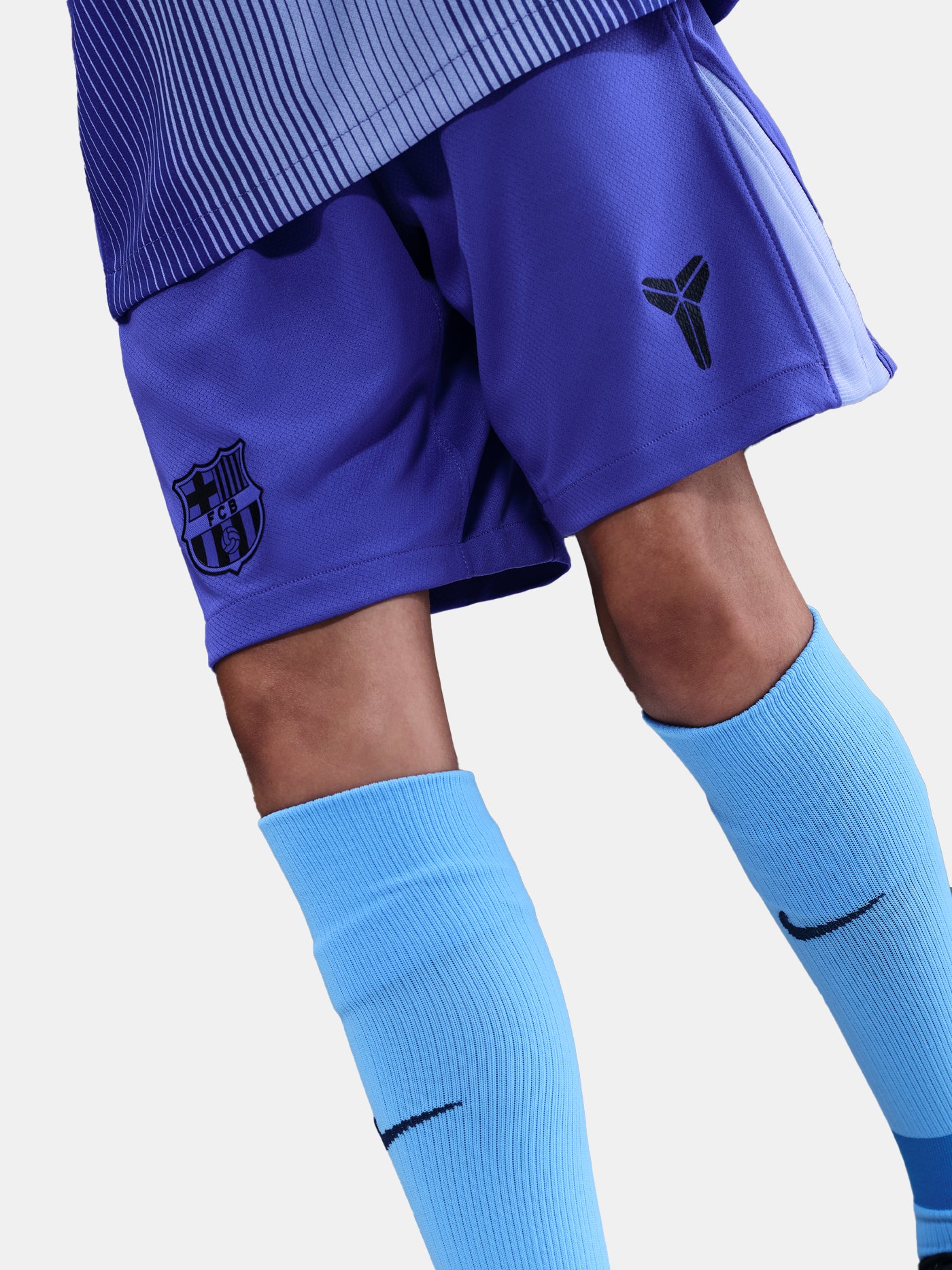 Blue sports shorts and socks with a logo on a light gray background