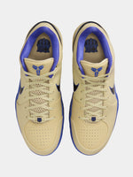 Beige and blue sneakers with a logo on a white background
