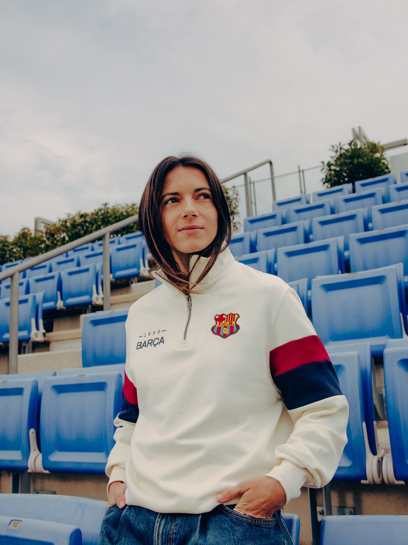 cream-colored Barça sweatshirt with red and navy sleeve stripes and embroidered club crest