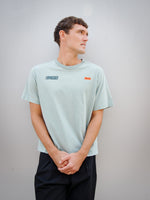 Christensen wearing a light green FC Barcelona T-shirt with tonal crest and 'Good Game Lover’s Crew' graphic print on the back