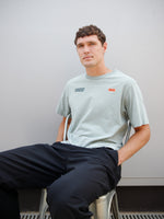 Christensen wearing a light green FC Barcelona T-shirt with tonal crest and 'Good Game Lover’s Crew' graphic print on the back