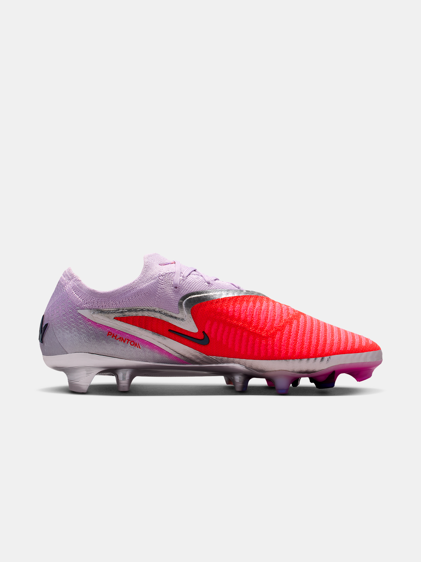Pink and red soccer cleat with Nike logo on a white background