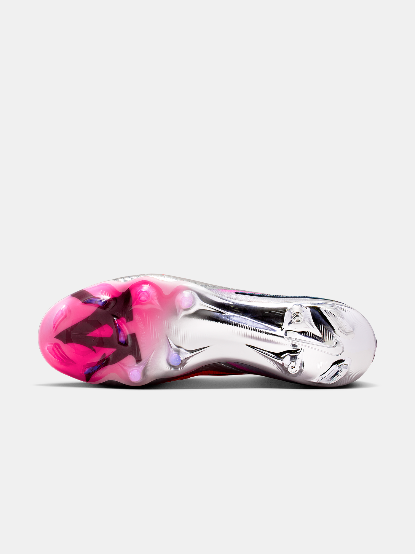 Silver shoe with pink sole on a white background