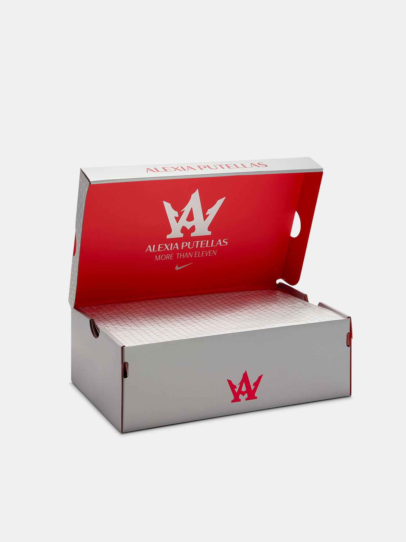 Open shoe box with red and white lid featuring a logo and text on a light gray background