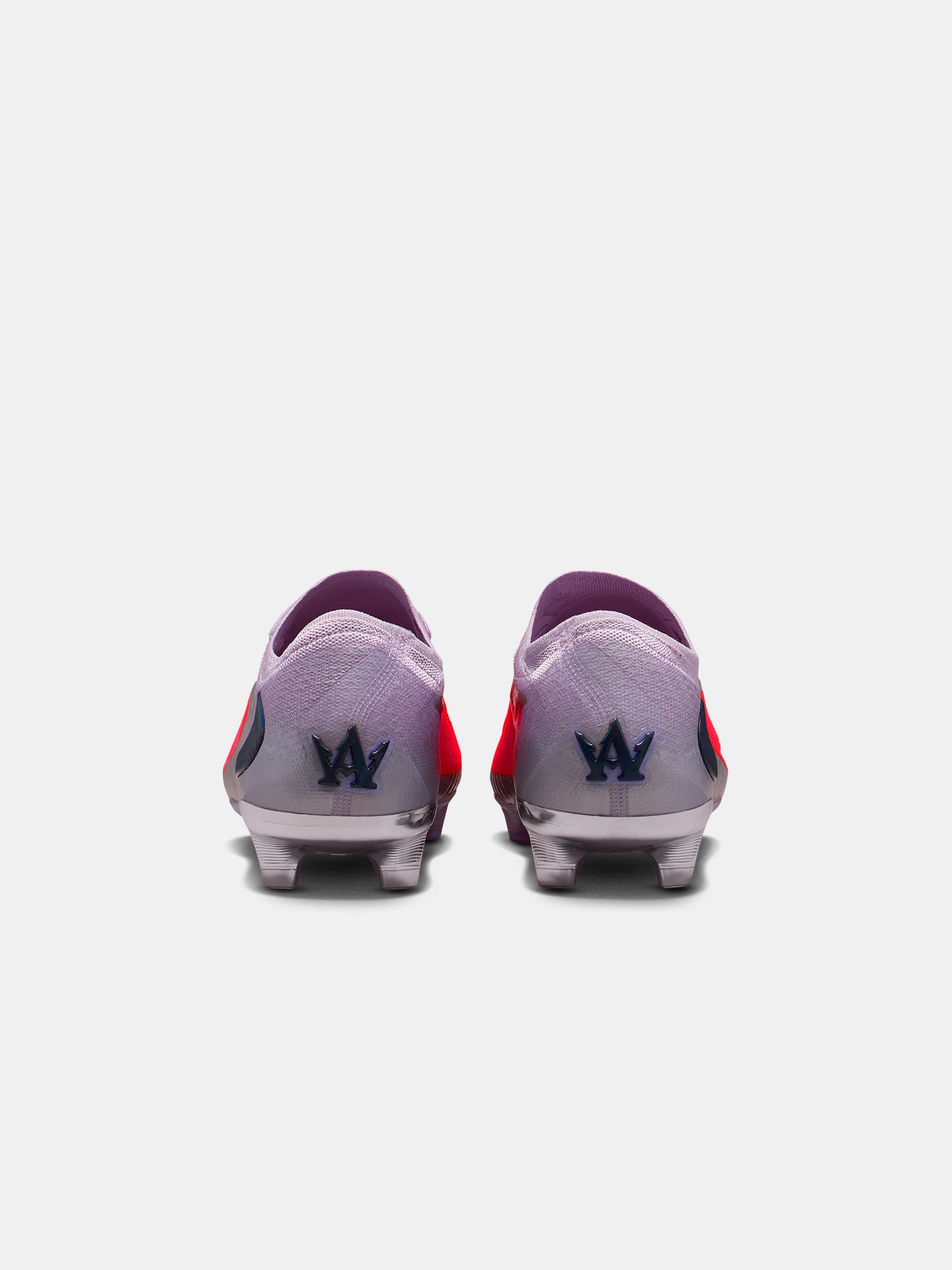 Pair of soccer cleats with a brand logo on a white background