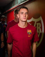 Marc Casado with Red FC Barcelona t-shirt with the club crest and yellow Nike logo on the chest