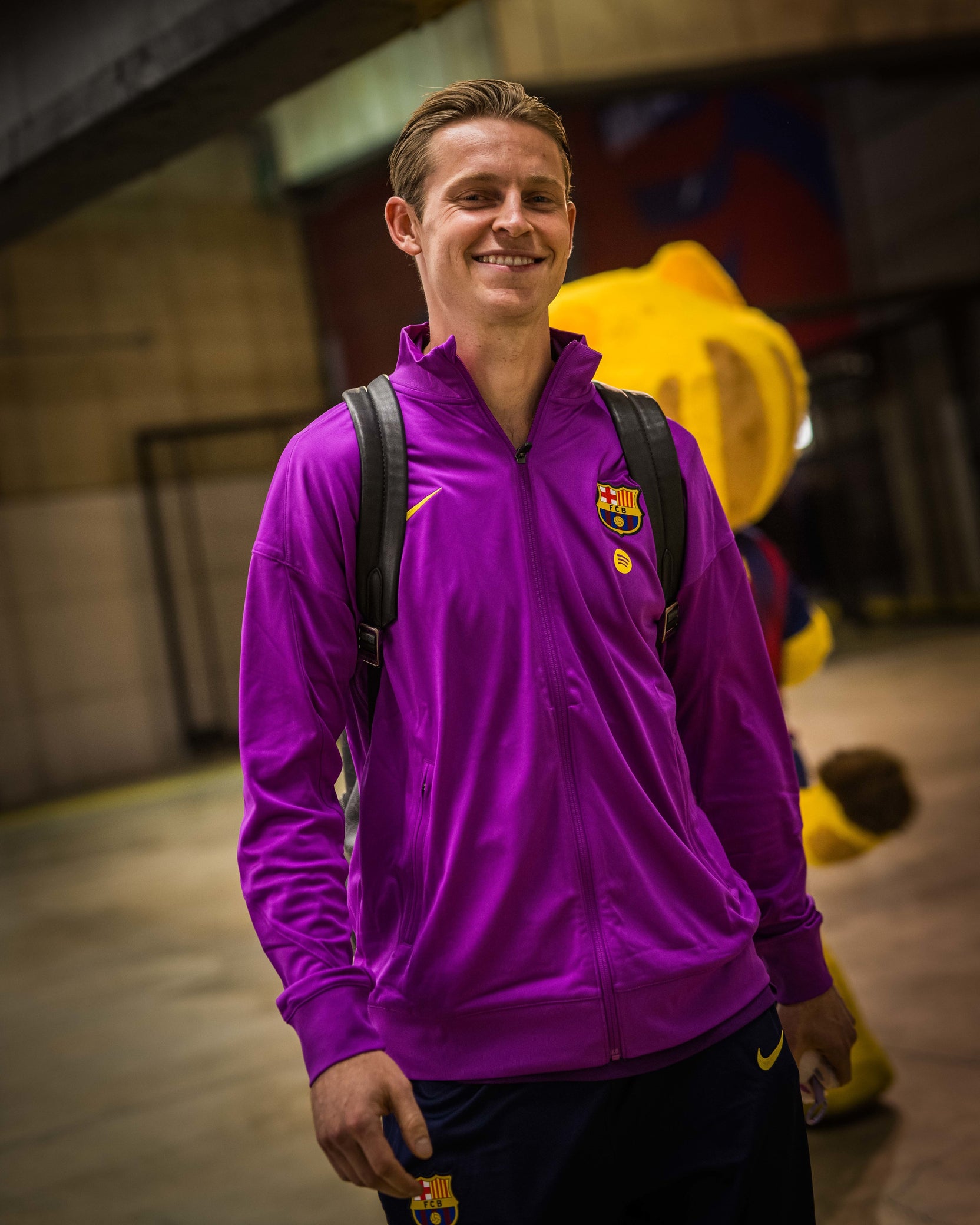 FC Barcelona 25/26 purple training jacket with crest and Nike swoosh, worn by player with backpack