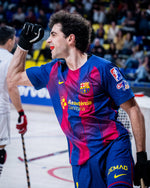 Person wearing a colorful sports jersey with visible branding in an indoor sports arena.