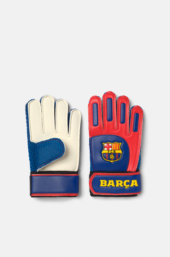 Pair of FC Barcelona goalkeeper gloves in red, blue, and white, featuring the club crest and 'BARÇA' text on the wrist strap