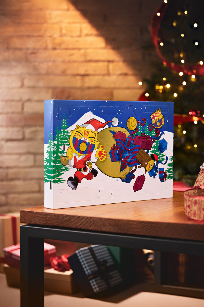 FC Barcelona advent calendar box with a festive cartoon cat in a Santa hat carrying gifts and a club crest on a blue winter scene.