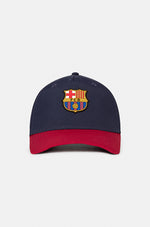 FC Barcelona baseball cap featuring a navy blue crown and a contrasting red visor, embroidered with the official club crest on the front.