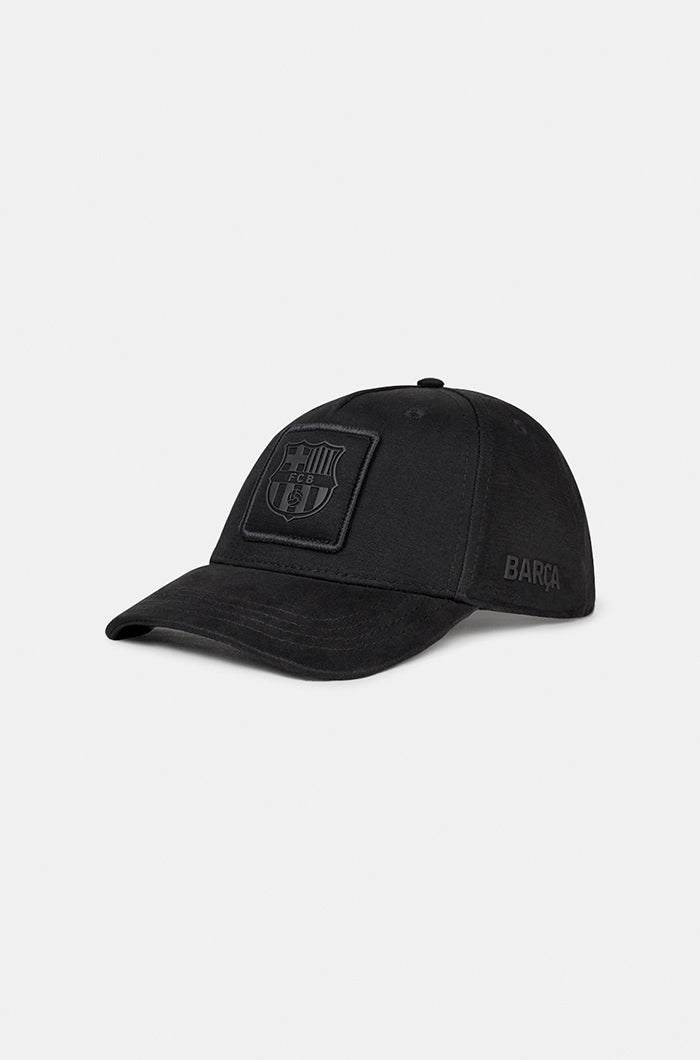 Black FC Barcelona baseball cap with a monochrome embroidered crest on the front panel and the word "BARÇA" stitched on the side