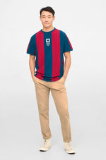 Retro-style FC Barcelona T-shirt with classic vertical blue and red stripes and a large white number 9 printed on the back.