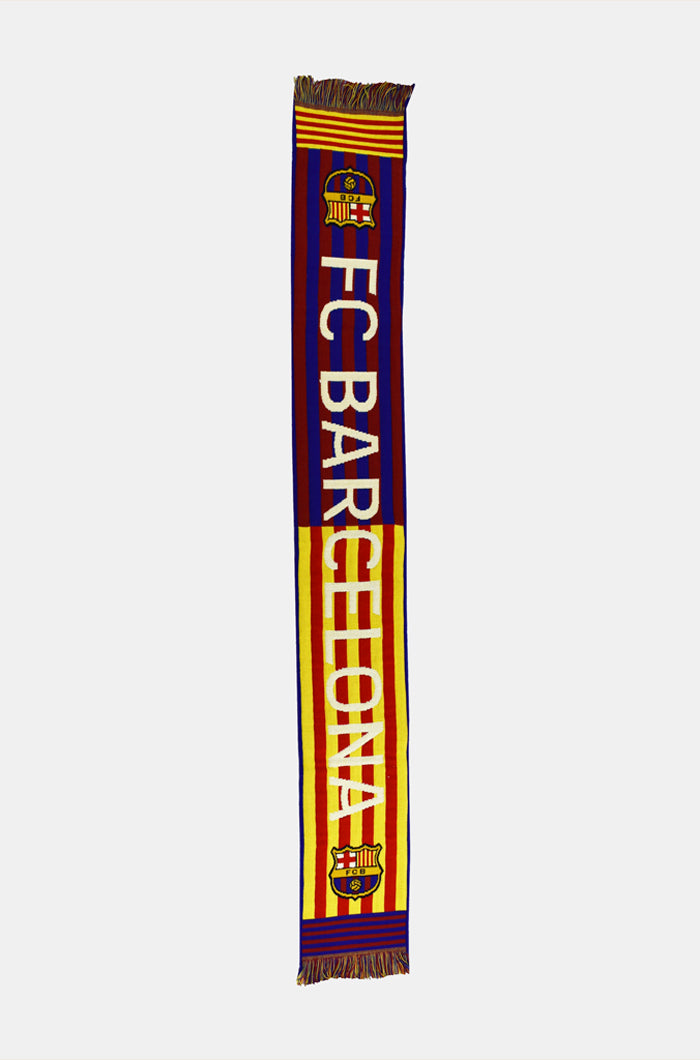 Double-sided FC Barcelona scarf in red, yellow, and blue stripes, featuring the club crest and bold white text reading 'FC BARCELONA