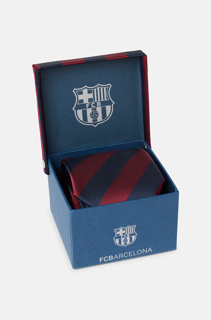 Elegant striped necktie in navy blue and maroon with the FC Barcelona crest embroidered near the tip