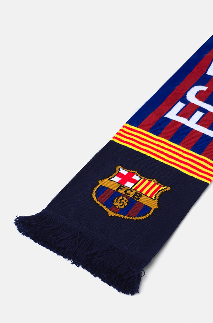 Double-sided FC Barcelona scarf with blue and red vertical stripes, featuring the club crest and the words 'FC BARCELONA' on one side and 'BARÇA' with '1899' on the other.