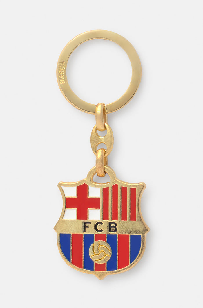 Gold-colored metal keychain featuring the official FC Barcelona crest in red, blue, and white